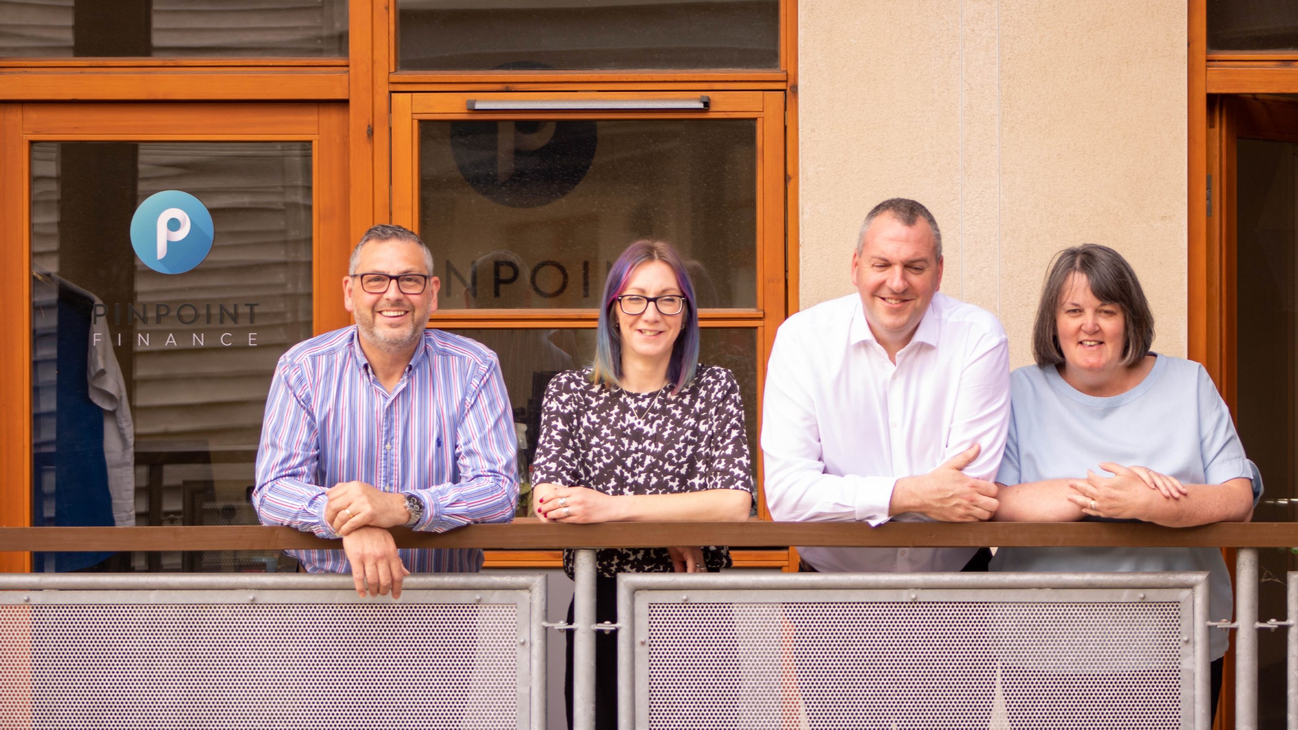 Group photo of Pinpoint Finance team members from left to right: Keith Humphreys, Anna Hatfield, Kelvin Smith, and Anne Baggaley. We are here to answer Why Should I Use A Mortgage Broker?