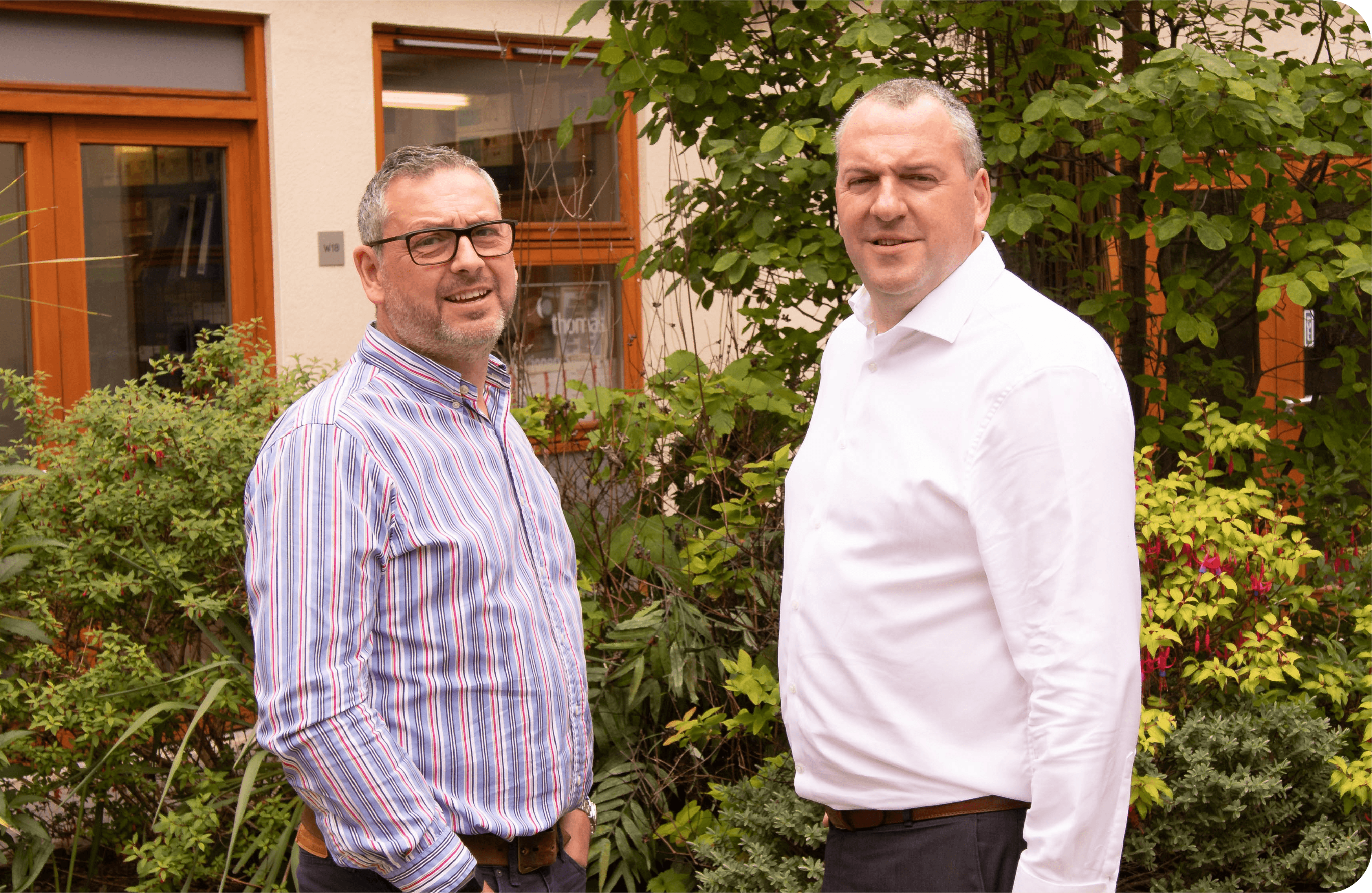 Image of Keith and Kelvin in the courtyard at York Eco Business Centre, representing Pinpoint Finance - refer a client